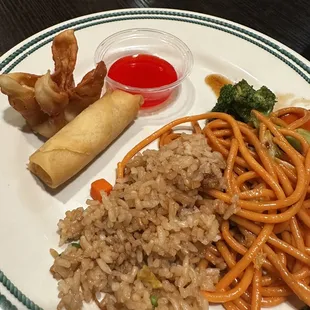a plate of asian food with rice and vegetables