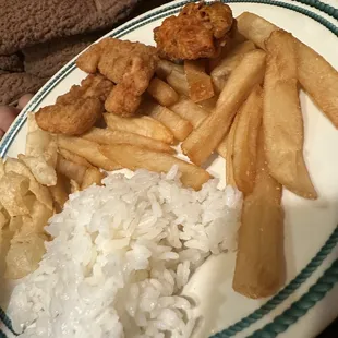 a plate of fried chicken, rice, and vegetables