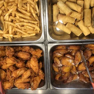 a variety of food items in trays