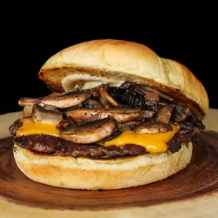 a hamburger with mushrooms and cheese