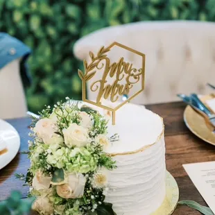 Cake he made for us to cut at the wedding. Decorated with flowers that matched the colors I told him