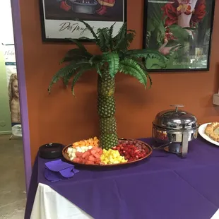 Pineapple tree with fresh fruit medley.