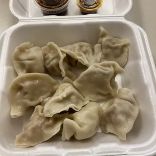 5 steam-fried pork dumplings and 5 steam-fried chicken dumplings