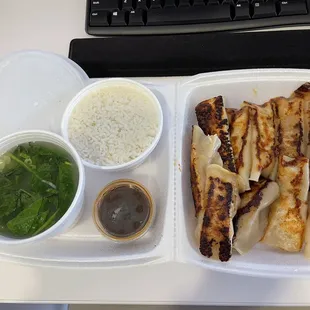 Wonton soup, steamed rice, pork pan fried dumplings