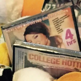 a pile of dvds and stuffed animals