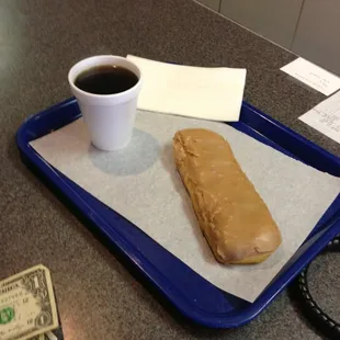 Maple bar with a cup of coffee.