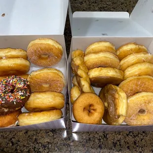 two boxes of doughnuts with sprinkles