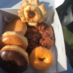 a variety of doughnuts in a box