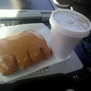 a cup of coffee and a doughnut