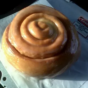 a cinnamon roll on a napkin