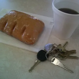 a cup of coffee and keys