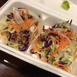 Chicken tacos. The chicken is there somewhere underneath that slaw