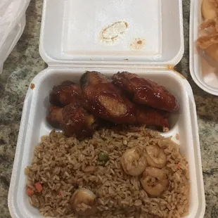 Chicken wings with honey BBQ sauce and shrimp fried rice.