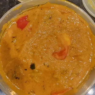 a bowl of soup and plates of food