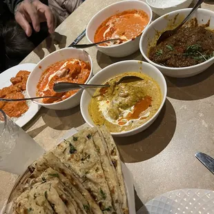 Garlic Naan, Chicken Korma(yellow), Butter Chicken &amp; Chicken Tikka Masala(red), Lamb Curry (brown)