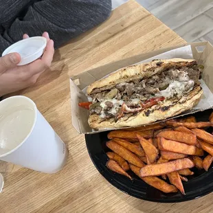 Philly cheese steak  and sweet potatoes  with coffee