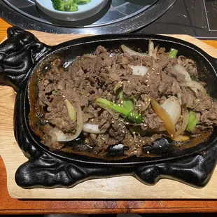 beef and broccoli in a skillet