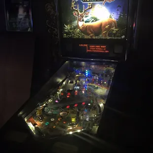 a pinball machine in the dark