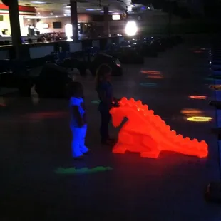 two children playing in the dark