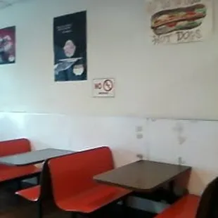 a nice little dining area where you can enjoy your coffee , donut or sandwich