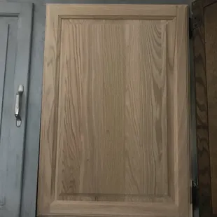 a close up of a kitchen cabinet door