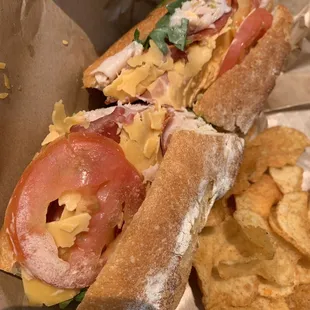 a sub sandwich and chips