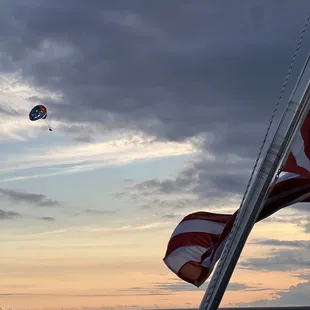 an american flag flying in the wind