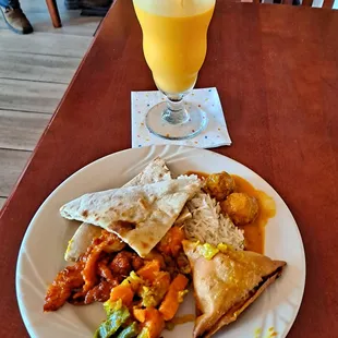 Mango Lassi, Naan, Basmati Rice, Chilli Chicken, Veg. Samosa, Lamb Meatballs, Aloo Matter Gaajar.