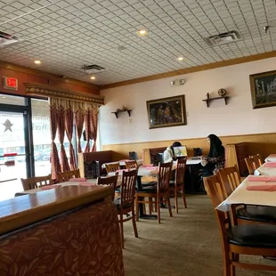 a dining area with tables and chairs