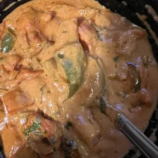 a bowl of curry with a spoon