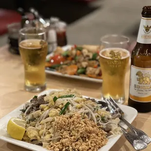 a plate of food and a beer