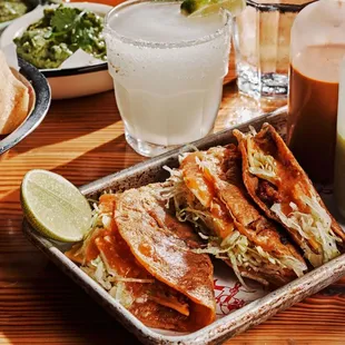 mexican food and drinks on a table