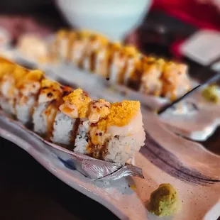 a close up of a plate of sushi