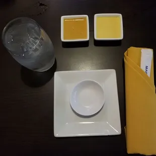 My place setting with mustard sauce and ginger dressing.