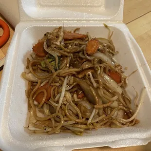 a container of noodles and carrots