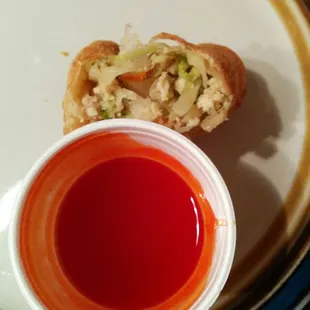 Eggroll filling and comes with sauce