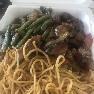a container of noodles and vegetables