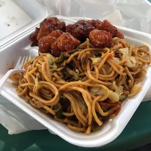 a plate of noodles and meat