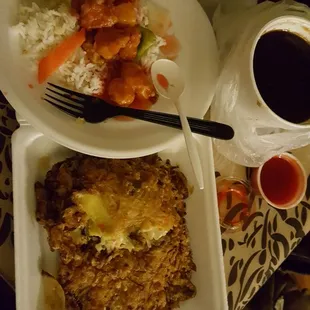 Steamed rice w/sweet n sour chicken.  Veggie egg foo young w/ a bowl of its brown sauce. Wish there were actual veggies w/ the egg patties.