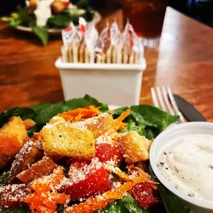 a plate of salad with dressing