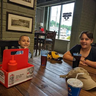 two children sitting at a table
