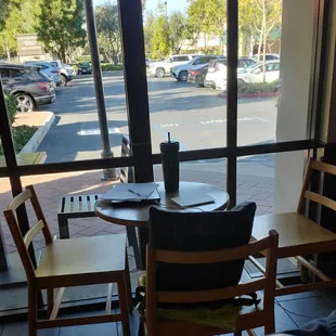 Starbucks employee squating