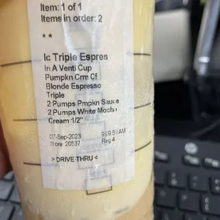 a hand holding a cup of coffee