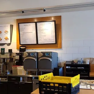 a coffee shop with coffee machines and menus