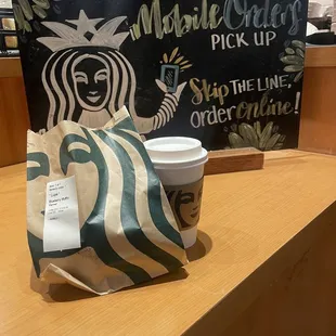 This is my Vanilla latte and warm blue berry muffin  order at the mobile stand for pick up