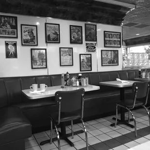 black and white photograph of diner booths