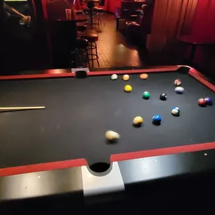 a pool table with balls on it