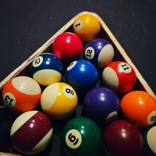 pool balls arranged in a triangle