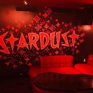 a red couch and a black table