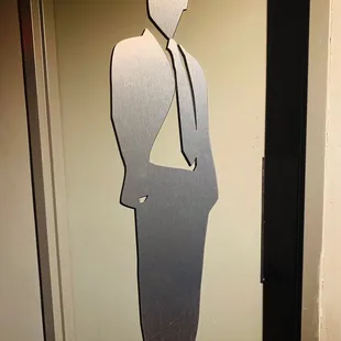 a silhouette of a man in a suit and tie